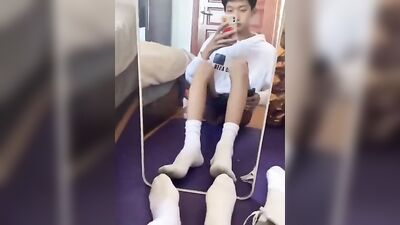 Young Asian Solo Show in Front of Mirror