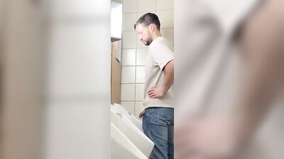Caught Peaking at Urinal: Steamy Gay Porn Video with Big Cocks and Bareback Action!