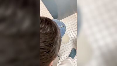 Young Twink Gets Oral Delight in the Public Toilet!