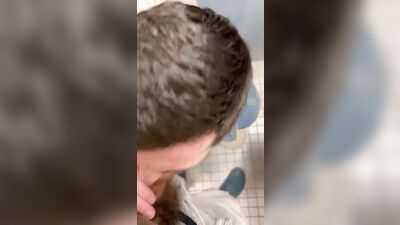 Young Twink Gets Oral Delight in the Public Toilet!