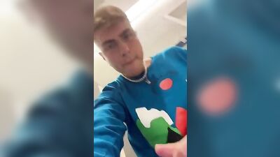 Self-confident blonde risks a public restroom wank with muscular boys