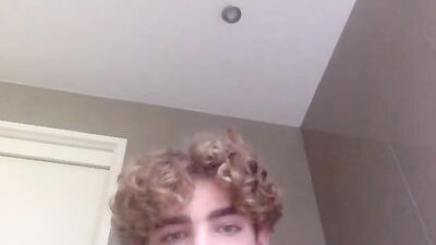 Curly blonde fitness enthusiast showcases his impressive manhood on camera