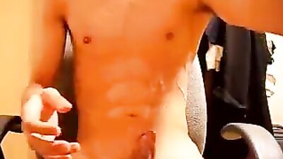 Young stud shows off his impressive physique by jacking off and covering himself in semen
