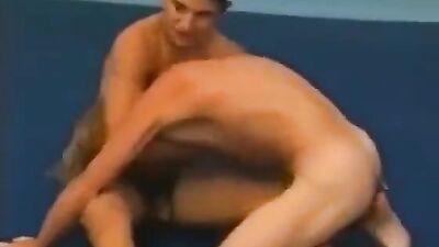 Muscular Wrestlers Brawl in Cinematic Classic: An Epic Battle of the Bulging Bodies