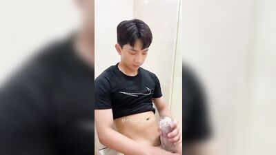 Young Man Pleasures Himself with His Toy while Enjoying the Sights and Sounds of a College Frat House