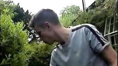 Flexing Muscles in the Garden: Amateur Boys Play with Fertilizer and Cocks