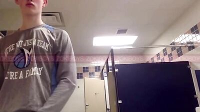 Red-haired hunk pleasures himself in the school gym locker room