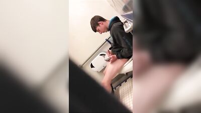Caught in the Act: A Handsome Teen Jerking Off in a Public Toilet