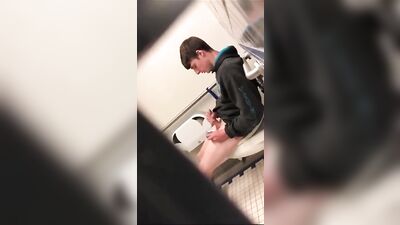 Caught in the Act: A Handsome Teen Jerking Off in a Public Toilet