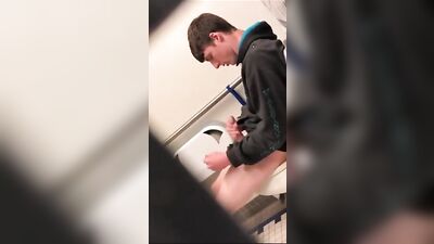 Caught in the Act: A Handsome Teen Jerking Off in a Public Toilet