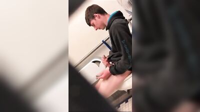 Caught in the Act: A Handsome Teen Jerking Off in a Public Toilet
