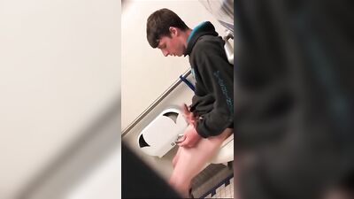 Caught in the Act: A Handsome Teen Jerking Off in a Public Toilet
