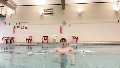 Cute fitness enthusiast pleasures himself at the community pool