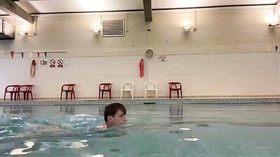 Cute fitness enthusiast pleasures himself at the community pool