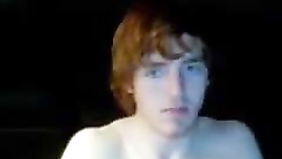 Young Scottish lad jerks off while chatting with sexy webcam models on his laptop - a gay solo masturbation video