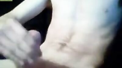 Young Scottish lad jerks off while chatting with sexy webcam models on his laptop - a gay solo masturbation video