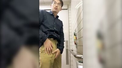 Japanese boy in glasses shows off his cum shot on the street during an amateur webcam session