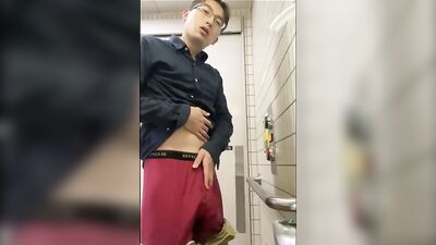 Japanese boy in glasses shows off his cum shot on the street during an amateur webcam session