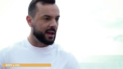 Sexy young men with their stiff cocks banging in an intense bareback interracial group threesome