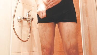 The guy washes in the shower and dances