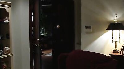 Leather-clad cop takes down a restrained inmate in a rough bondage scene