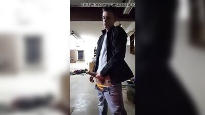 Young stud with a big dick pleasures himself in the garage while enjoying his own semen