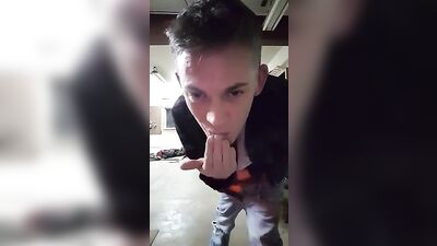 Young stud with a big dick pleasures himself in the garage while enjoying his own semen