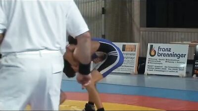 Muscular Hunks In Skintight Suits Engage In Rough And Tumble Play