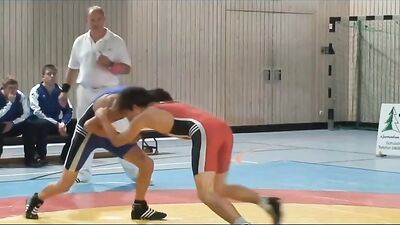 Muscular Hunks In Skintight Suits Engage In Rough And Tumble Play