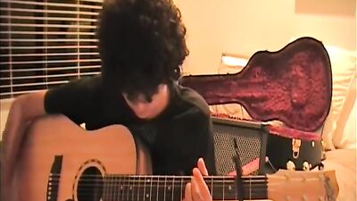 Guitar-Playing Cutie Gets Seduced By Strapping Lads!