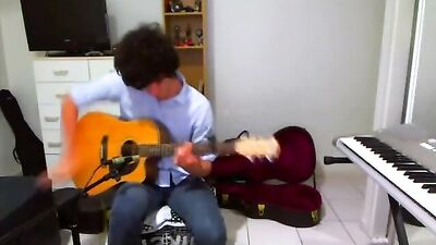 Guitar-Playing Cutie Gets Seduced By Strapping Lads!