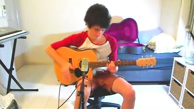 Guitar-Playing Cutie Gets Seduced By Strapping Lads!