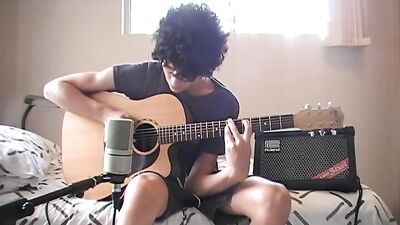 Guitar-Playing Cutie Gets Seduced By Strapping Lads!