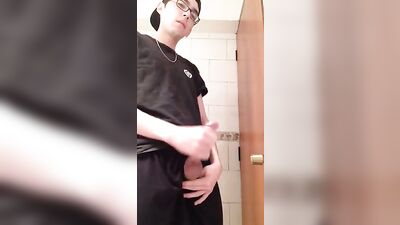 A young man with spectacles spurts and moans in ecstasy