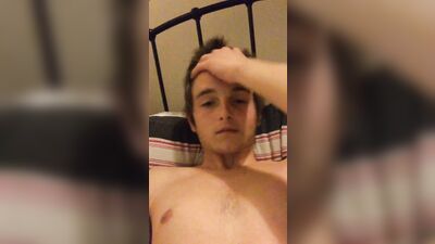 Cute UK twink jerks off his smaller uncircumcised cock in a handjob session with big loads of cum