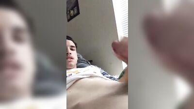 Young stud with a hard cock gets down on his knees and strokes his shaft