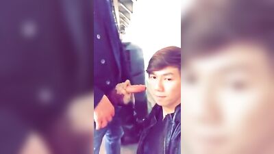 Young Asian Man Gets a Blowjob in Public at the Train Station