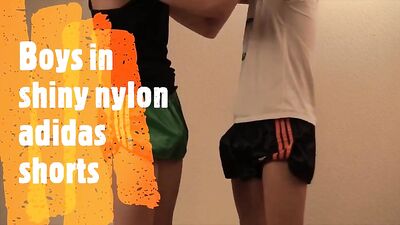 Boys in shiny nylon adidas shorts