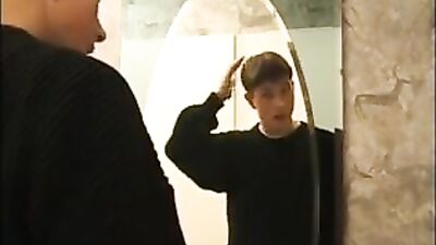 Boy jerks off in front of mirror