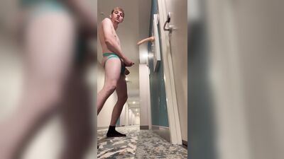 Twink playing in hotel hallway