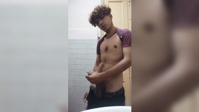 young man masturbates big cock in the bathroom