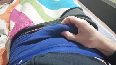 Guy in blue underpants plays with his dick, rubs his dick