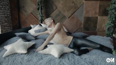 Seductive leather twink in leggings playing with cock on the bed
