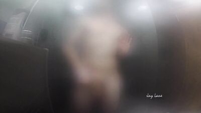 Twink jerks off and presses cock against glass in steamy shower session