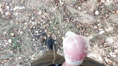Young horny twink found a used condom in the woods, so he put his cock in it and spermed