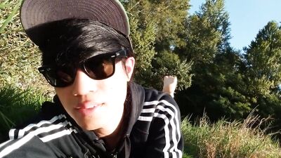 Jon Arteen walks barefoot on the grass, shows the soles of his feet in close-up, does the giant feet