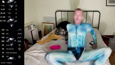 male camming model seducing viewer in his blue bedazzled superhero bodysuit (lol no homo)