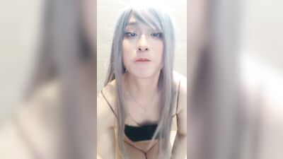 Femboy sucks on dildo