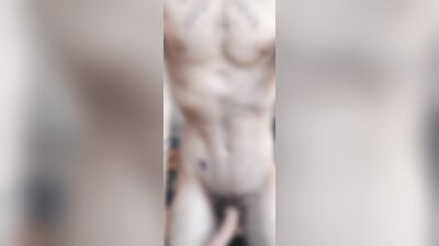 Tatted guy grinding cock in hand