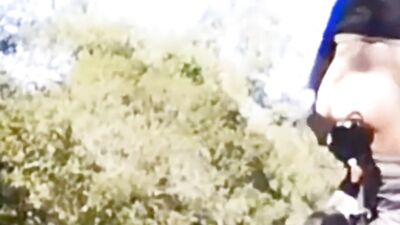 Very daring and very handsome boy plays with his bicycle in public